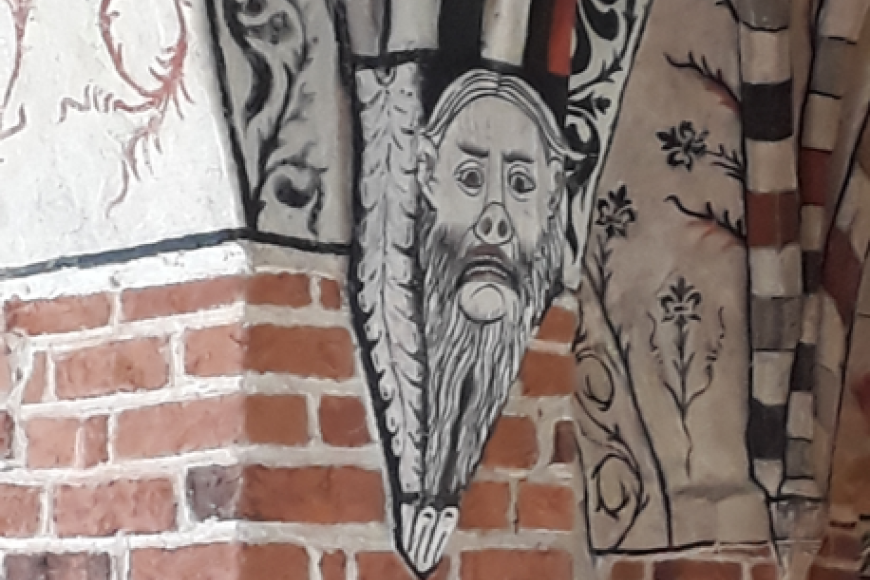 a church mural presenting a distorted face