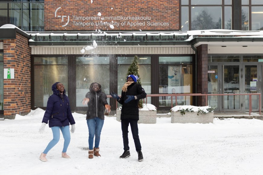 The three interviewed Kenyan nursing students enjoying the snowy weather outside.