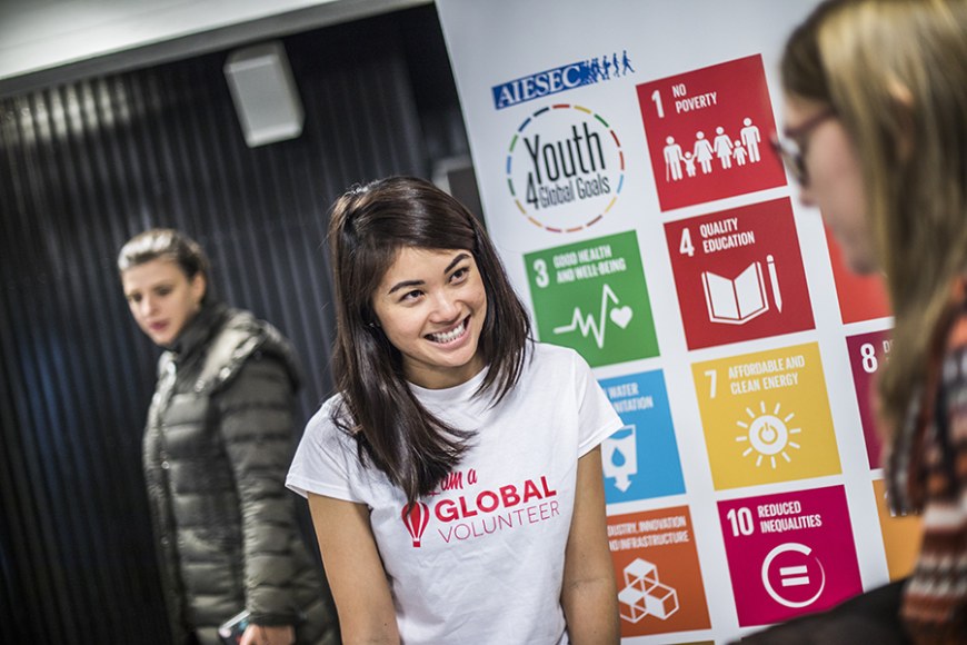 Student showing the sustainable development goals of the university.
