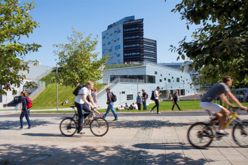 People bicycling at the Hervanta campus.