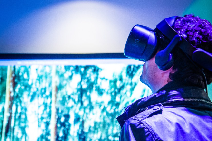 A person using a VR headset with data visualizations