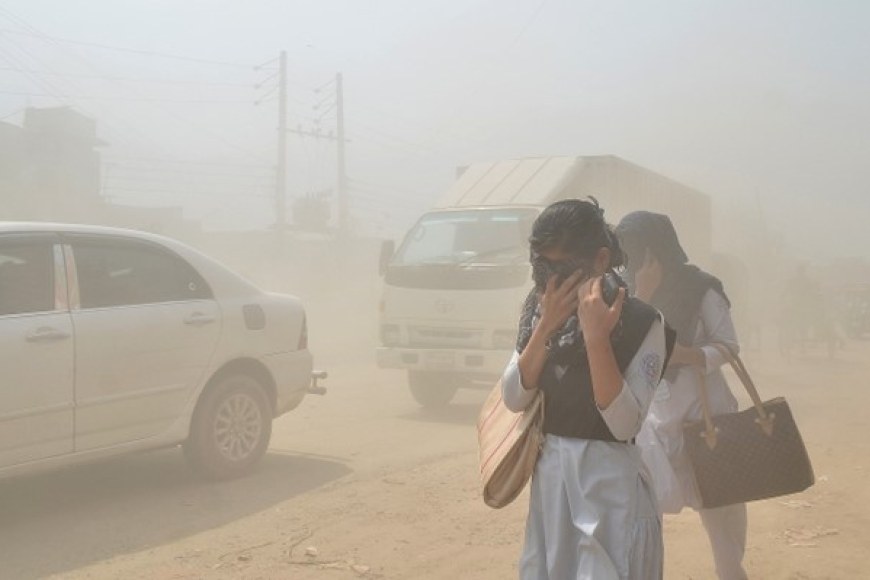 Two people covering their nose and mouse on a street of a town where air is heavily polluted..