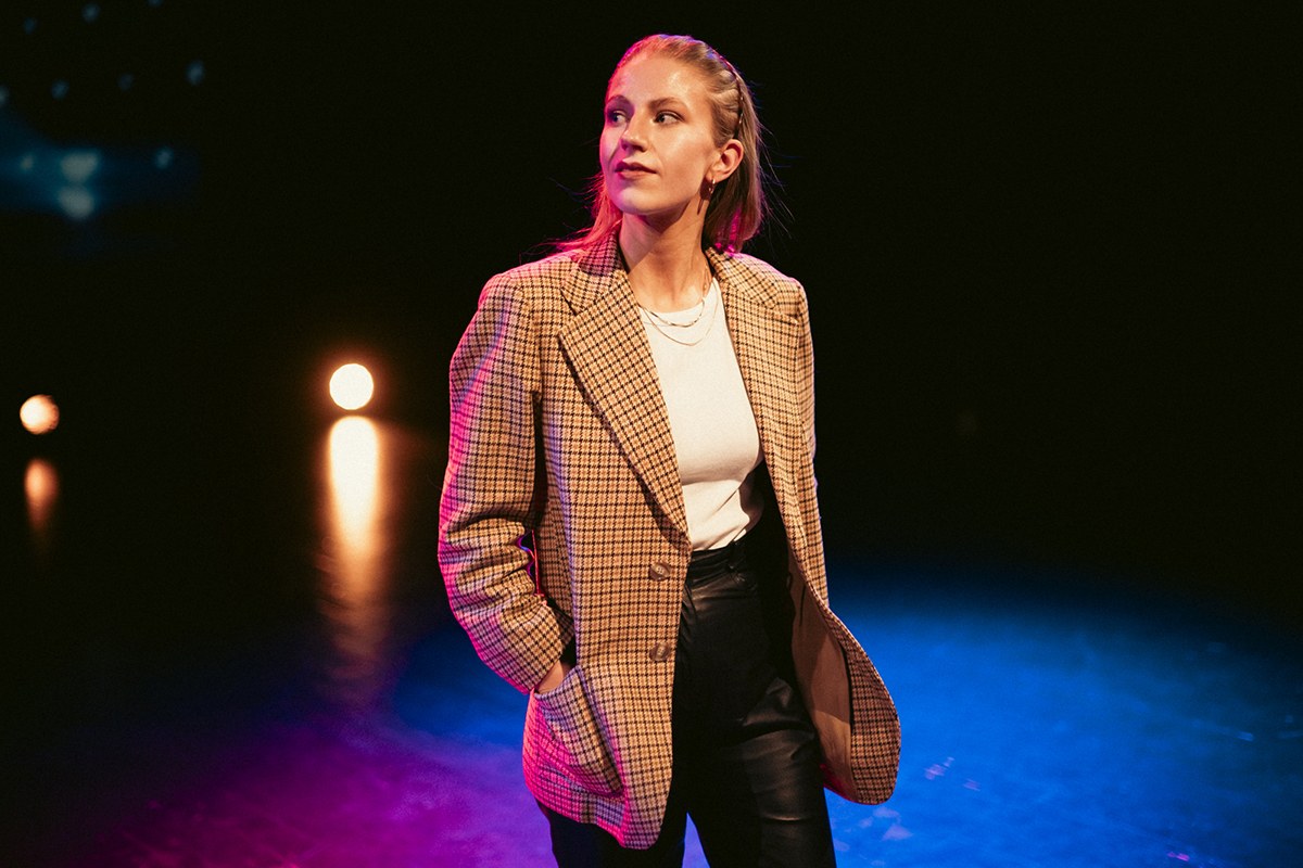 Lotta Ylinen, doctoral researcher, Convergence, photographed at the Tampere University Theatre Studio.