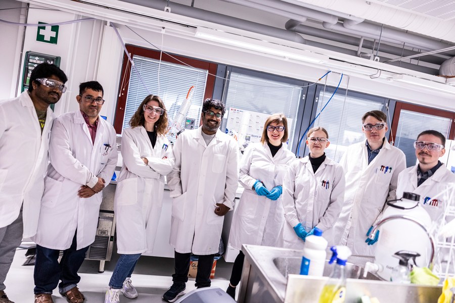 Group of researchers wearing a laboratory jacket.