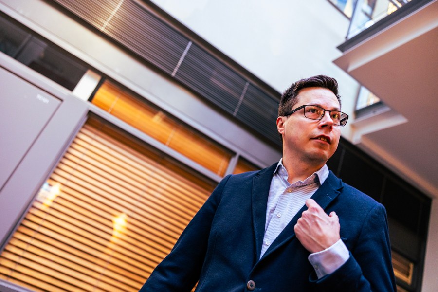Aki Jääskeläinen in the lobby of the building.