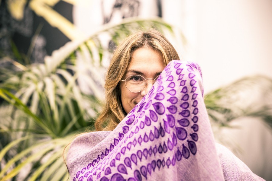 Professor Maija Hirvonen is watching towards the camera. She has a scarf that shadows part of the face.