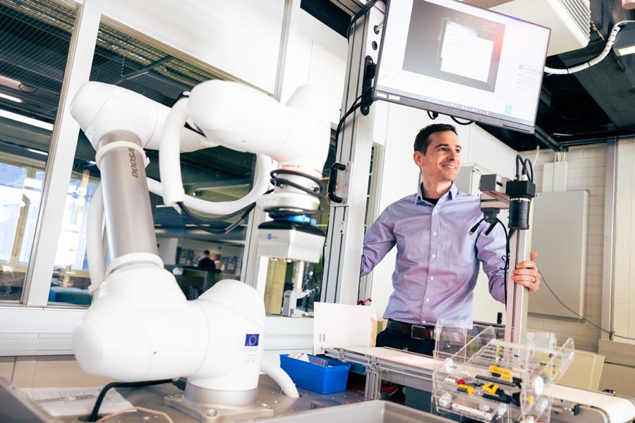 Man in a robot laboratory.