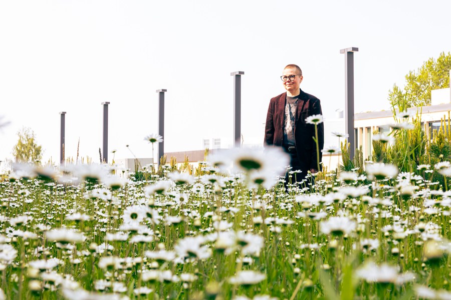 Joa Hiitola in the middle of the city meadow.