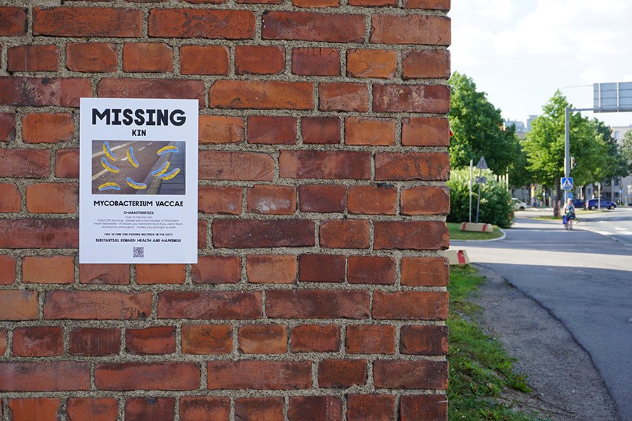 Poster on the brick wall.