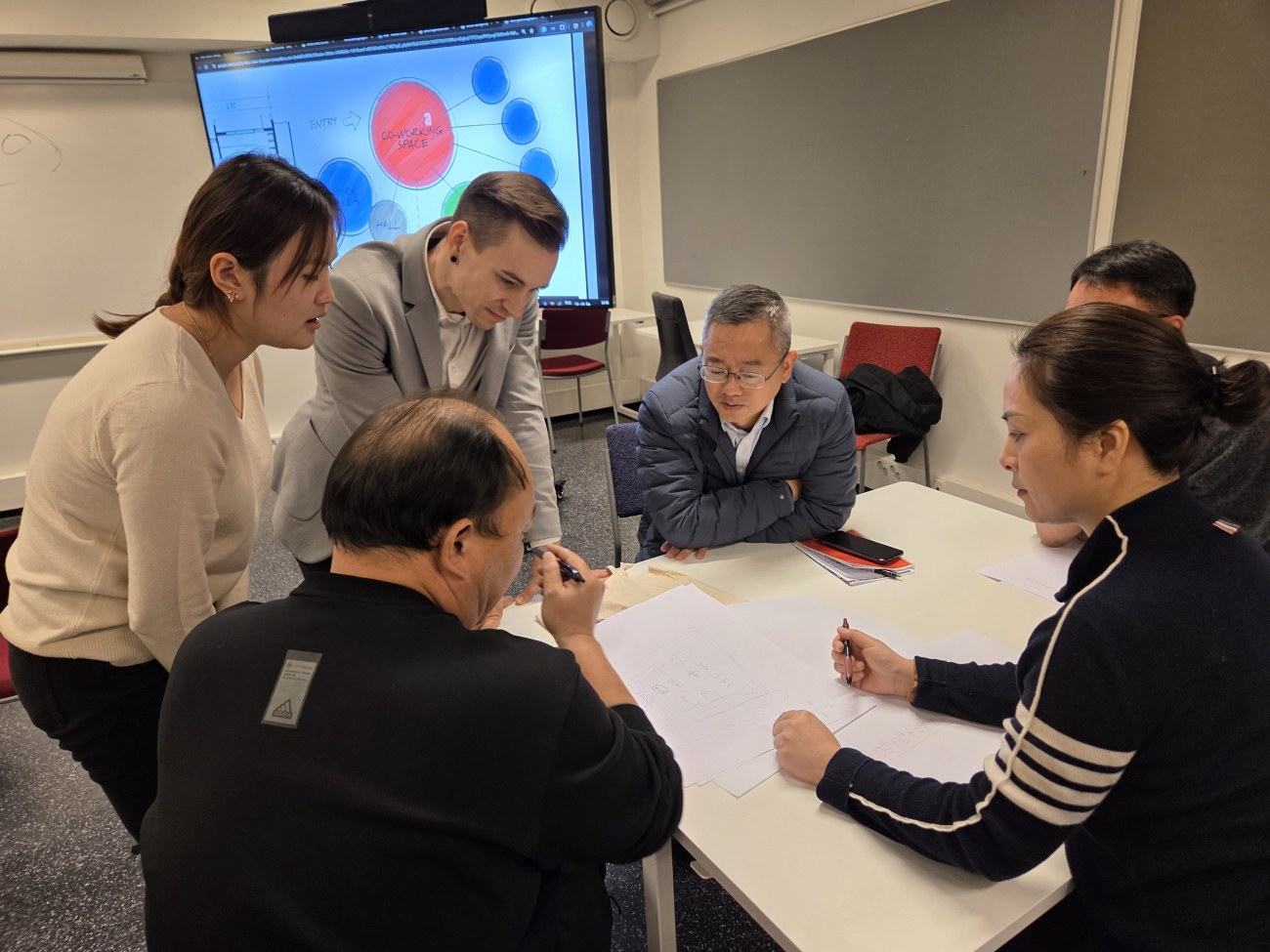 School principals from Jiangxi, China at school design workshop with TAMK teacher Kasmir Jolma