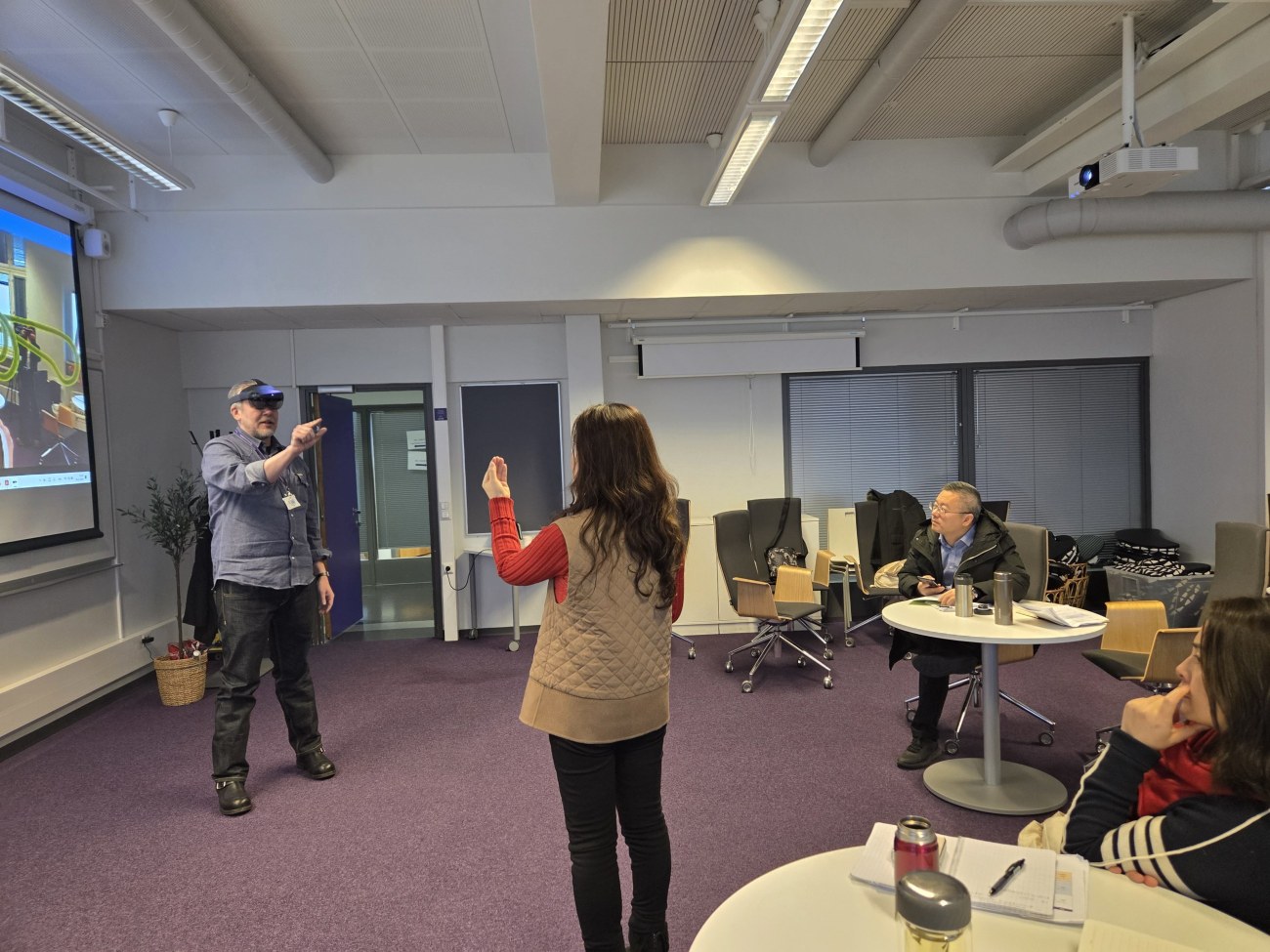 Chinese school principals learning about VR at TAMK with Ville Palkinen