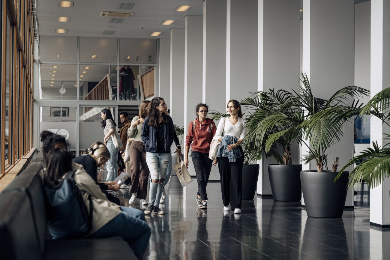 Students walking in a hallway.