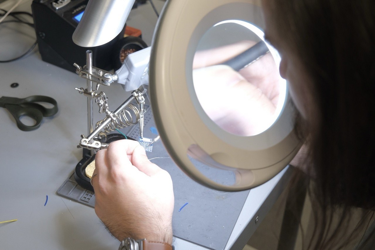 Oz Buruk is doing his research, there is a magnifying glass in the picture